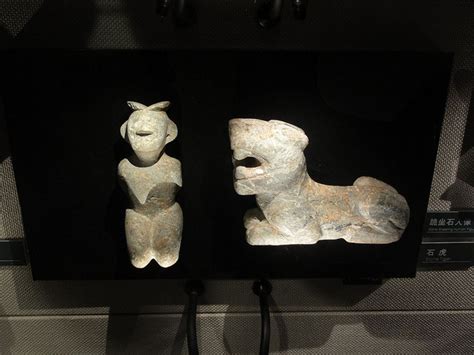 Stone Kneeling Human Figure And Stone Tiger At Jinsha Site Museum