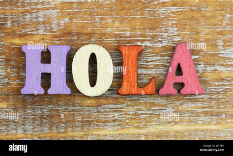 Hola (Hello in Spanish) written with colorful wooden letters Stock Photo - Alamy