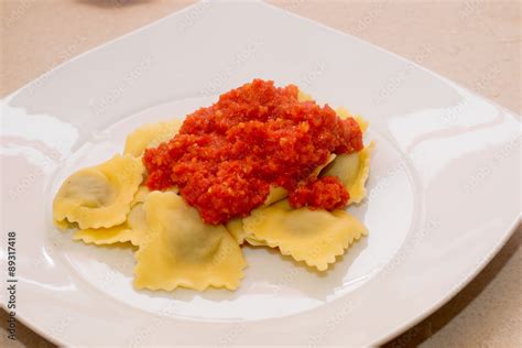 Ravioli Al Brasato Con Sugo Di Pomodoro Fresco Stock Photo Adobe Stock