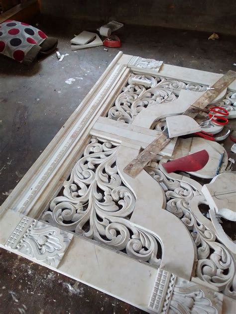 An Intricately Carved Piece Of Wood Being Worked On