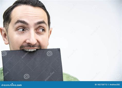 Portrait Of Funny Mid Adult Caucasian Businessman Grimacing And Mocking