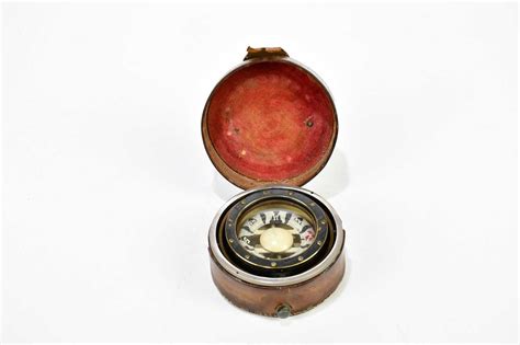 Lot 1359 An Early 20th Century Leather Cased Compass