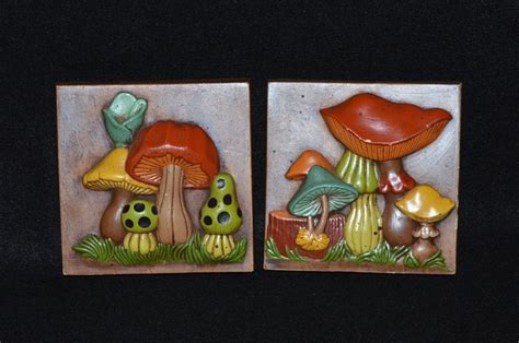 Two Small Ceramic Plaques With Mushrooms On Them