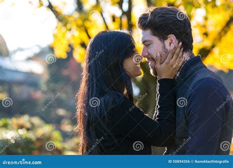 Couple Kissing In Front Of Autumn Tree Stock Photo Image Of Handsome