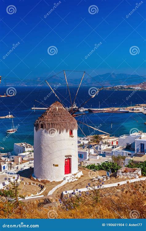 View Of The Famous Mykonos Windmill Above Port And Mykonos Town Stock