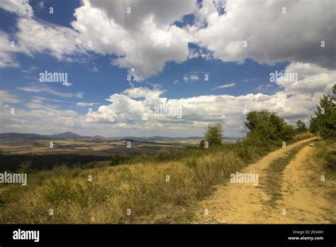 Landscape with country road Stock Photo - Alamy