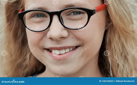 Portrait Of A Young Smiling 11 Year Old Girl With Glasses Stock Image