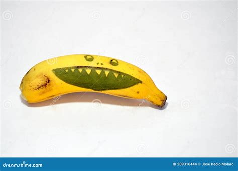 Banana Fruit with Drawing of a Smiling Face on White Background Stock ...