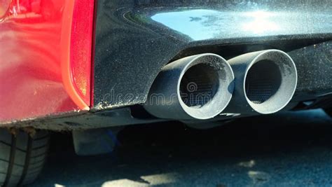 Close Up Of Exhaust Pipe Of A Red Car Twin Exhaust Pipes Stock Image