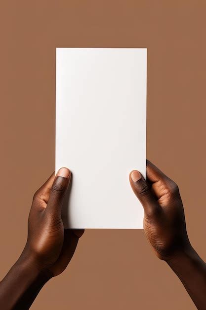 Premium Ai Image A Human Hand Holding A Blank Sheet Of White Paper Or