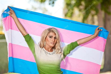 Transgender Holding Up Pride Flag Stock Photo By Lewchin