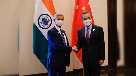 Eam Jaishankar Meets Chinese Counterpart Wang Yi In Bali Calls For