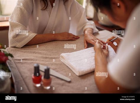 Woman Getting Her Nails Done By A Manicurist In A Beauty Salon Hands