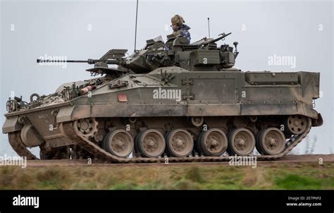 British Army Warrior Tank Armoured Vehicle On Manoeuvers In A