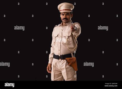 Portrait Of An Indian Policeman Pointing With Baton Stock Photo Alamy