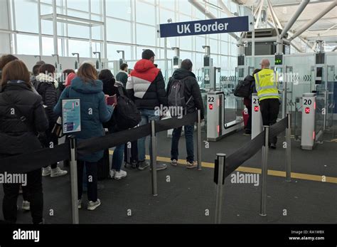 People Travelling And Queuing At Electronic Uk Border Passport Control