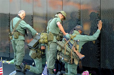 Veterans At Vietnam Wall Photograph by Carolyn Marshall