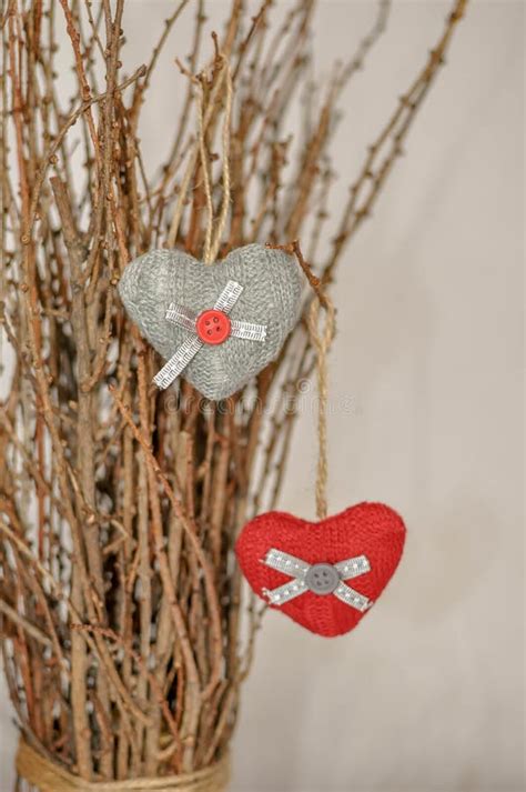 Two Knitted Hearts Hanging On A Branch Symbol Of Love And Valentine`s