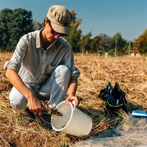 Premium Photo Soil Testing Agronomy Inspector Taking Soil Sample