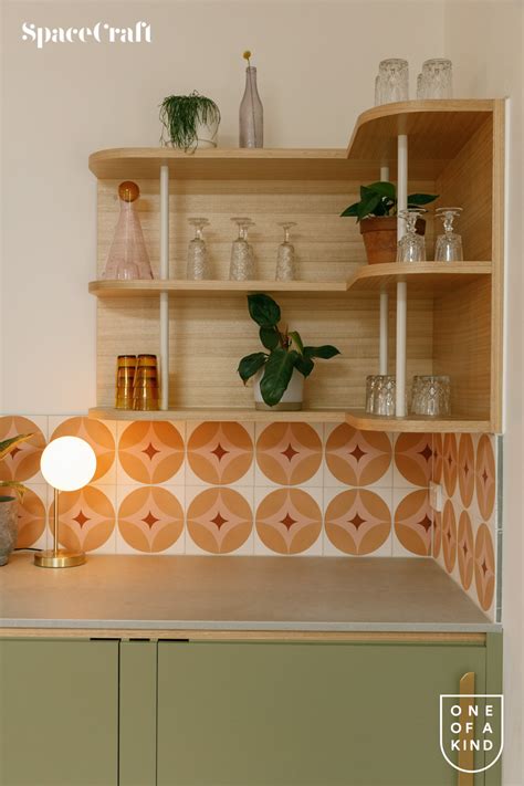 A Shelf With Some Plants On Top Of It Next To A Lamp And Potted Plant