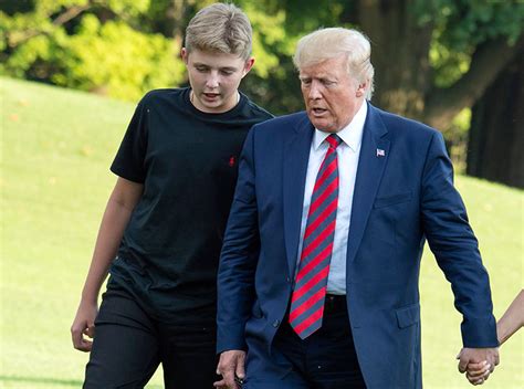 President Donald Trump and his son Barron Trump return to the White ...