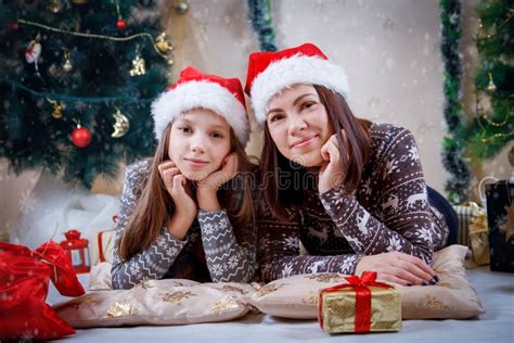 Happy Mother And Daughter Hugging In Christmas Hat Stock Image Image