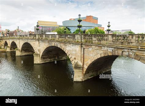 Welsh bridge over the River Severn at Shrewsbury, and Theatre Severn ...