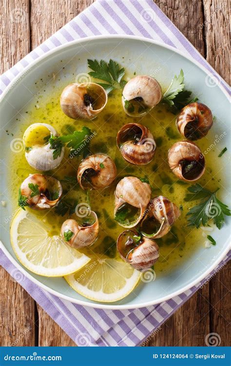 Spicy French Snails, Escargot Cooked with Butter, Parsley, Lemon Stock Photo - Image of gratin ...