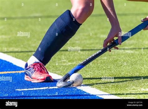 Hockey game female player hand leg short corner with ball and stick on astro turf Stock Photo ...