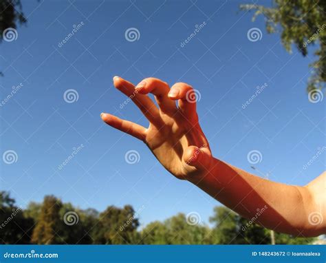 Female Hand Makes Frightening Or Grabbing Movement Palm Forward One