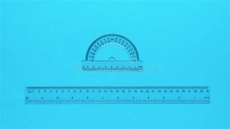 Transparent Protractor And Transparent Ruler On A Blue Background Stock