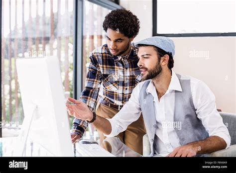 Happy Gay Couple Using Computer Stock Photo Alamy