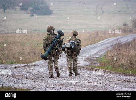 British Army Soldiers Completing An 8 Mile Combat Fitness Test Tabbing