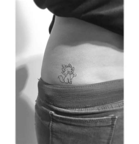 Fine Line Style Marie Tattoo Located On The Waist