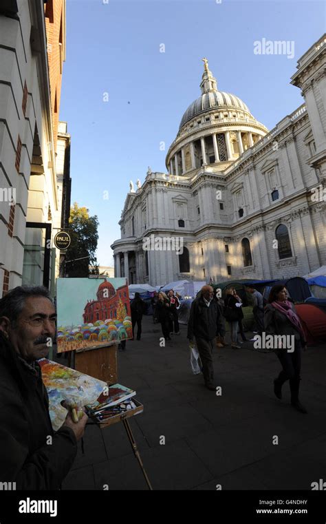 An Artist Paints A Picture Of The Anti Capitalist Camp Outside St Paul