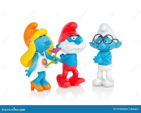 The Smurfs Smurfette Pappa Smurf And Brainy Toys Isolated On White