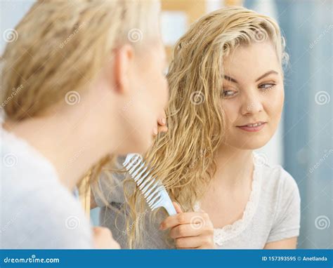 Woman Brushing Her Wet Blonde Hair Stock Image Image Of Beauty Long