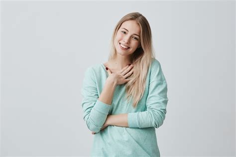 Free Photo Happy Blonde Woman Glad To Recieve Present From Husband Has Joyful Expression