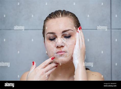 Face Skin Care Woman Applying Facial Cleanser On Face Closeup Girl