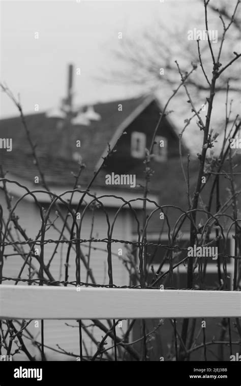 Traditional wire fence surrounding the farm in black and white Stock ...