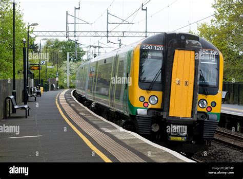 London Midland class 350 electric train at Long Buckby station ...