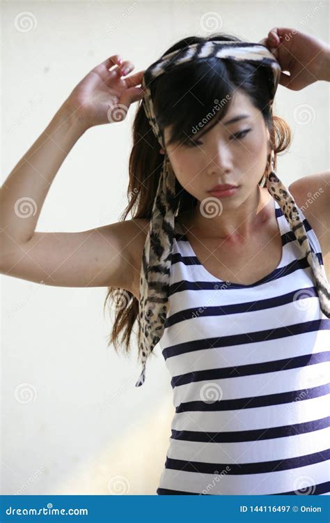 Beautiful Asian Woman Putting A Headband On Stock Image Image Of