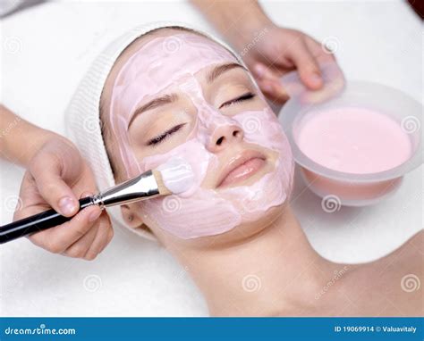 Girl Receiving Cosmetic Pink Facial Mask Stock Photo Image Of Pink