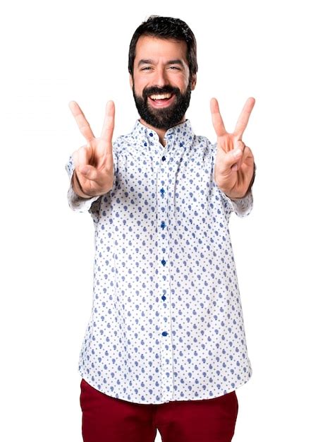 Free Photo Handsome Brunette Man With Beard Making Victory Gesture