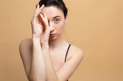 Image With Beautiful Brunette Touching Her Lips On Grey Background The