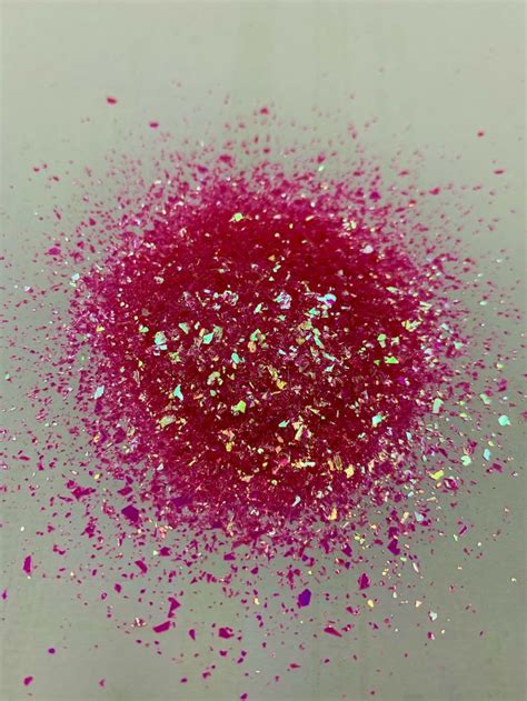 Pink And Gold Glitter Sprinkles On A White Surface