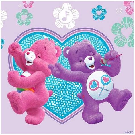 Two Purple Teddy Bears Are Dancing Together In Front Of A Heart Shaped