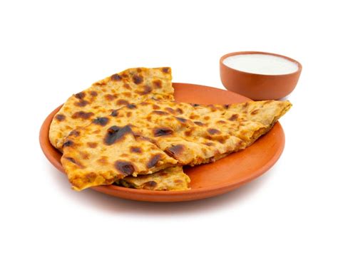 Premium Photo Indian Breakfast Dish Aloo Paratha Served With Curd On