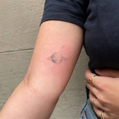 Single Needle Saturn Tattoo Located On The Inner Arm Saturn Tattoo