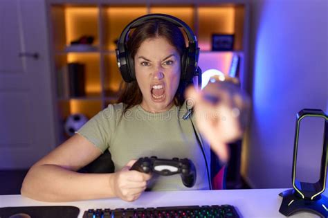 Beautiful Brunette Woman Playing Video Games Wearing Headphones